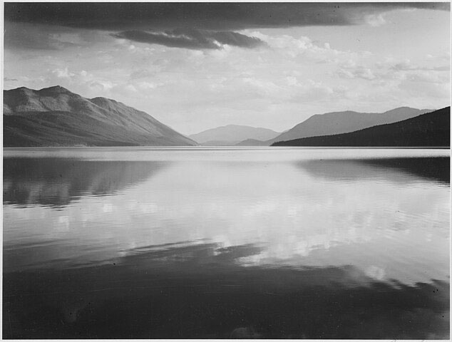 Evening, McDonald Lake, Glacier National Park, photograph, 1942. Photo: Public domain in the U.S. This is a peaceful view of Glacier National Park which was established by Congress in 1910 as the nation's tenth national park.