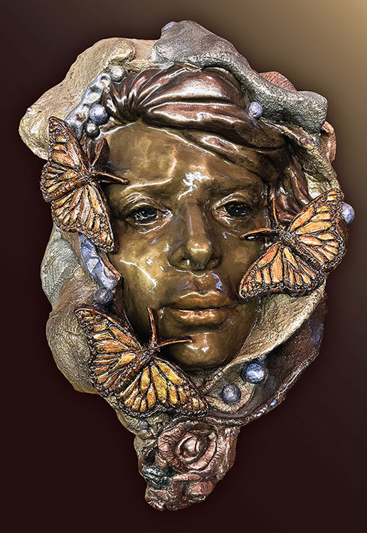 "Butterfly Love" (11H x 7W x 4D). It is Clay, Resin and Patina. 