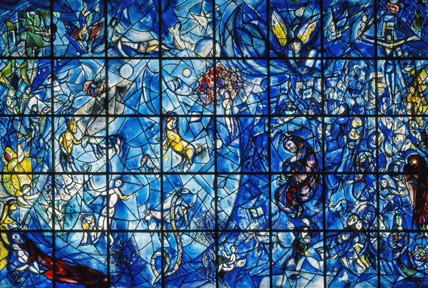 The memorial, a stained-glass window about 15 feet (4,6 meters) wide and 12 feet (3,7 meters) high, contains several symbols of peace and love, such as the young child in the center being kissed by an angelic face which emerges from a mass of flowers. On the left, below and above, motherhood and the people who are struggling for peace are depicted. Musical symbols in the panel evoke thoughts of Beethoven's Ninth Symphony, which was a favourite of Mr. Hammarskjöld's.