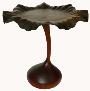 Hanna Flower Petal Table, 2025, walnut and African sapele, 32"height x 32"diameter (onions and knife are not part of the sculpture)