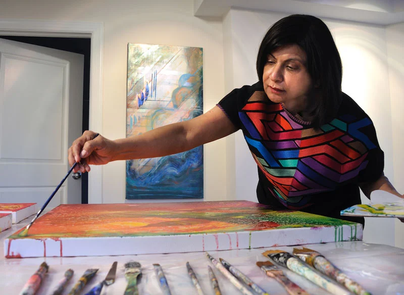 Nimi Trehan in her studio, working on the Aurora series